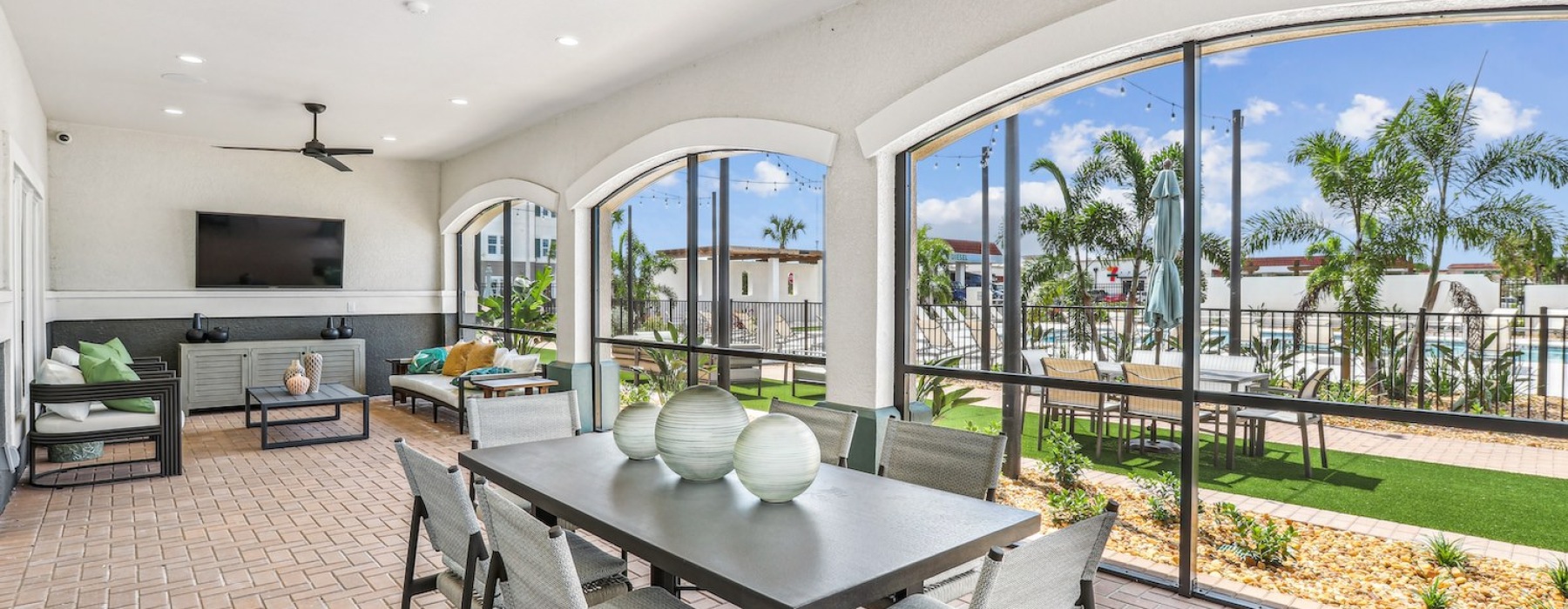 Screened-in veranda attached to the resident clubhouse at Revello